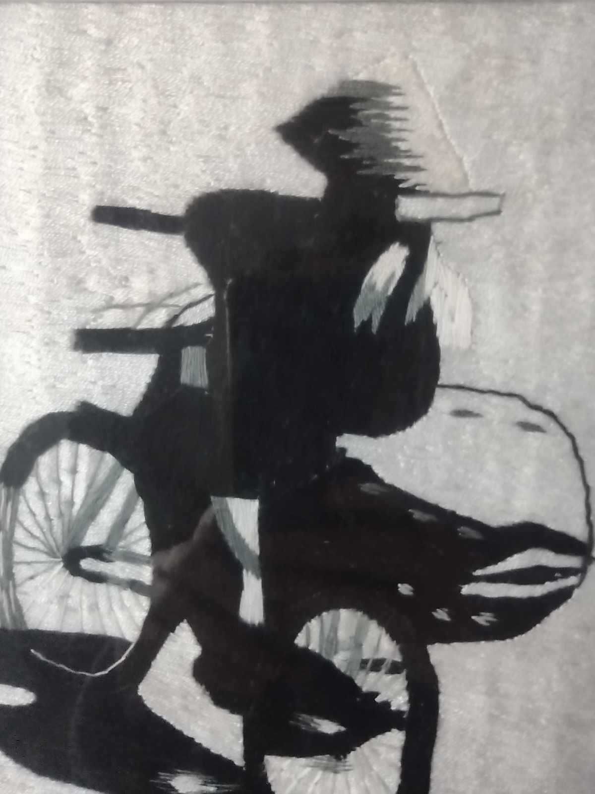 Obraz haftowany - postać na rowerze