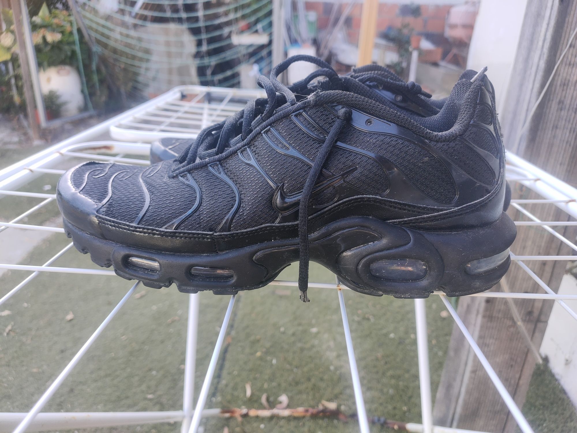 Tênis pretos Nike