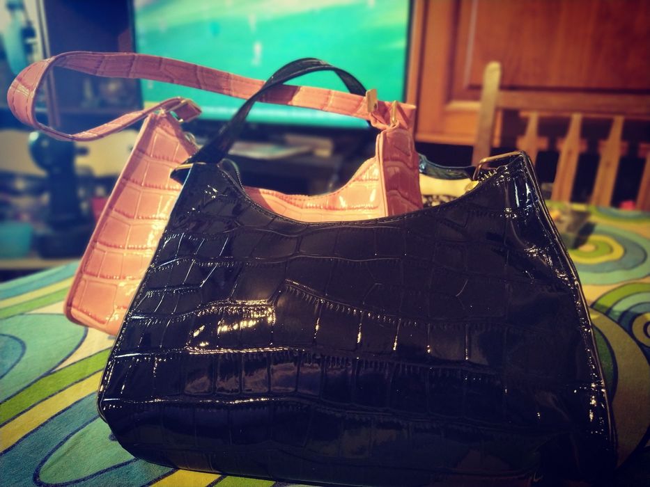 Malas e carteiras novas