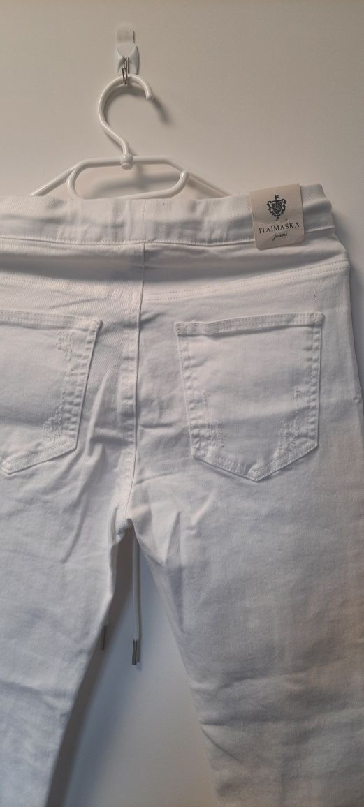 Białe z metką rurki skinny przetarcia rozm 36 S