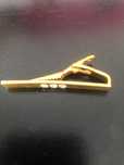 Clip de gravata dourado