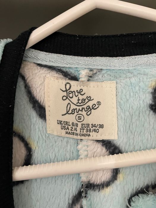 Pijama estilo babygrow azul com pinguins