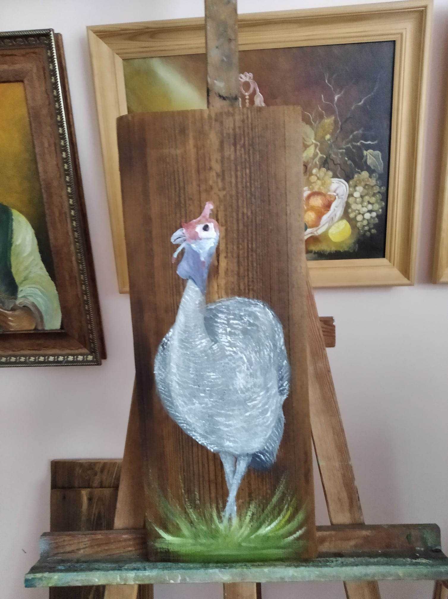Kogut na starej desce.