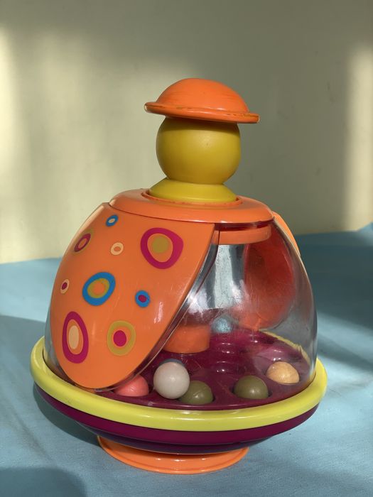 Розвиваюча іграшка, игрушка Battat Юла-мандаринка