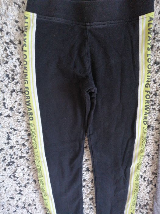 Legginsy H&M 134 spodnie elastyczne dziewczęce czarne z lampasem