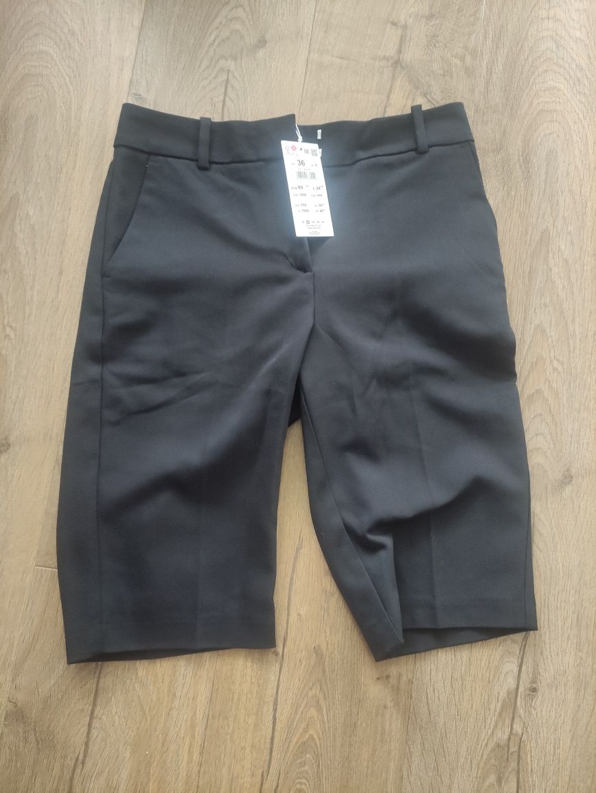 Nowe czarne materiałowe eleganckie shorty do kolan