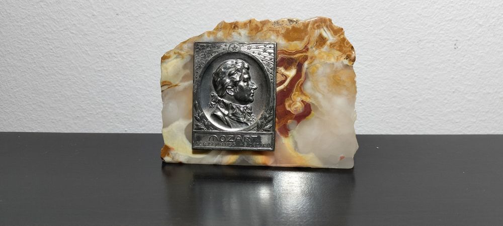 Барельеф Моцарта. Металл с серебрением на камне.