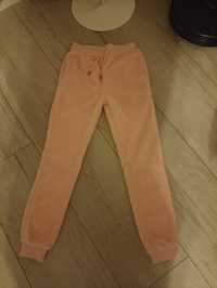 Nowe spodnie pluszowe różowe 134/140