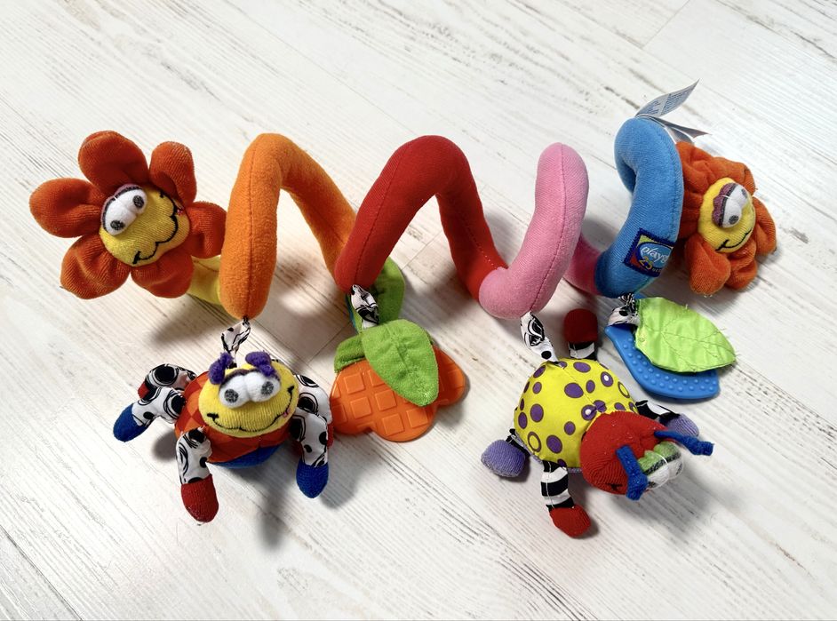 Іграшки для немовлят: спіральки, жираф, слоник, змійки.