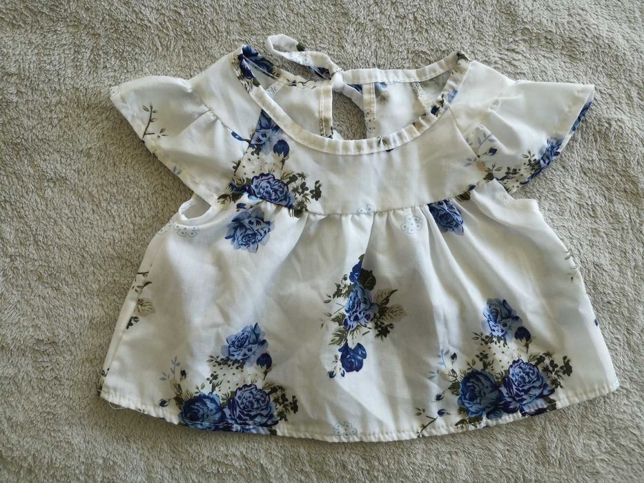 Biała elegancka zwiewna wiązana bluzka w kwiatki 68 - 74 jak nowa