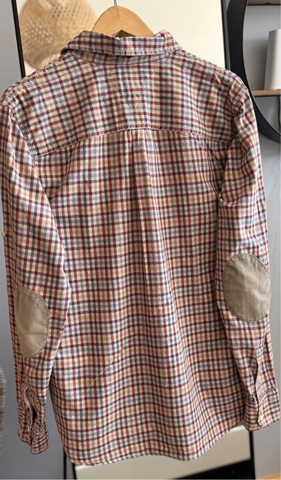 Retro sukienka w grochy pudrowy róż z falbanką wiązana koktajlowa