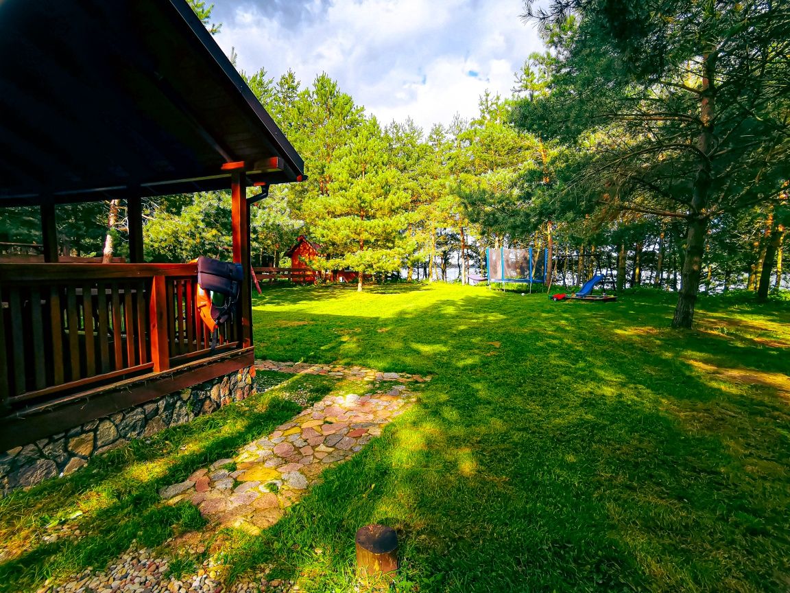 Dom linia brzegowa bania jacuzzi sup Mazury łódka kominek plaża Grill
