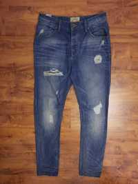 Spodnie jeansowe jeansy z przetarciami Loose W30 orientacyjnie M