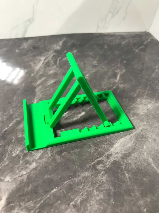 Універсальна регульована підставка для телефону