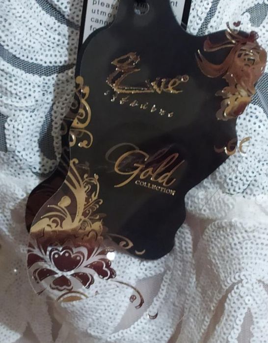 Блискуча ажурна сукня в паєтки