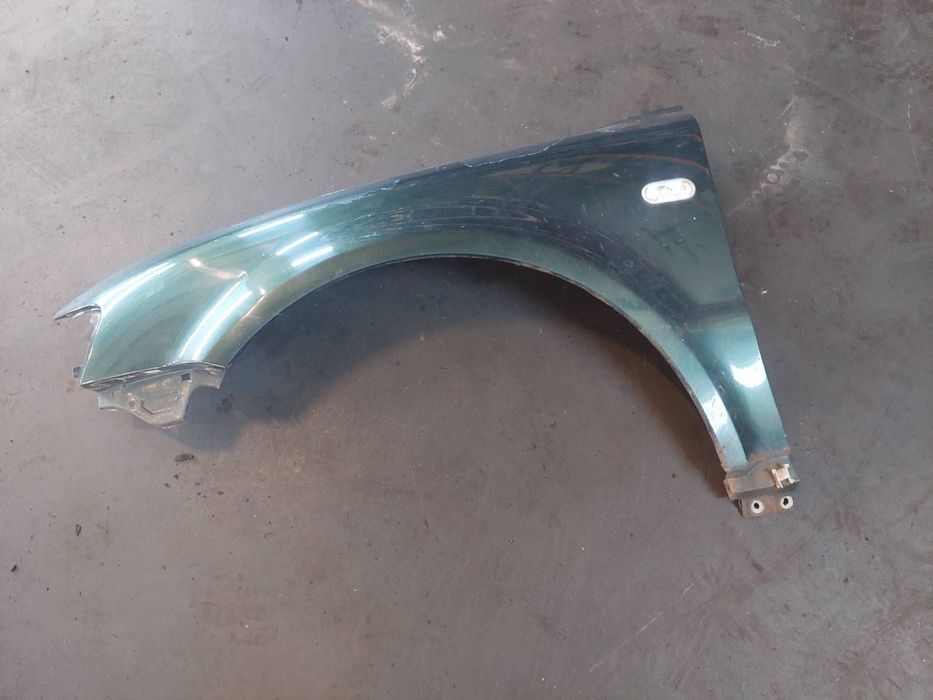 BŁOTNIK LEWY PRZÓD VOLKSWAGEN PASSAT B5 LC6N