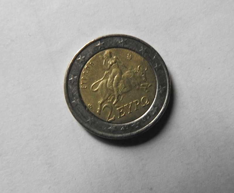 Dwie monety 2 euro z błędami.