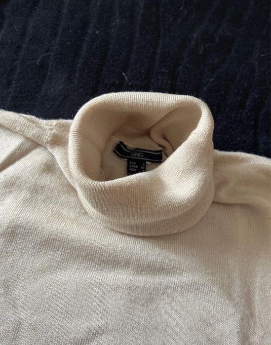 Camisola de gola alta sem mangas