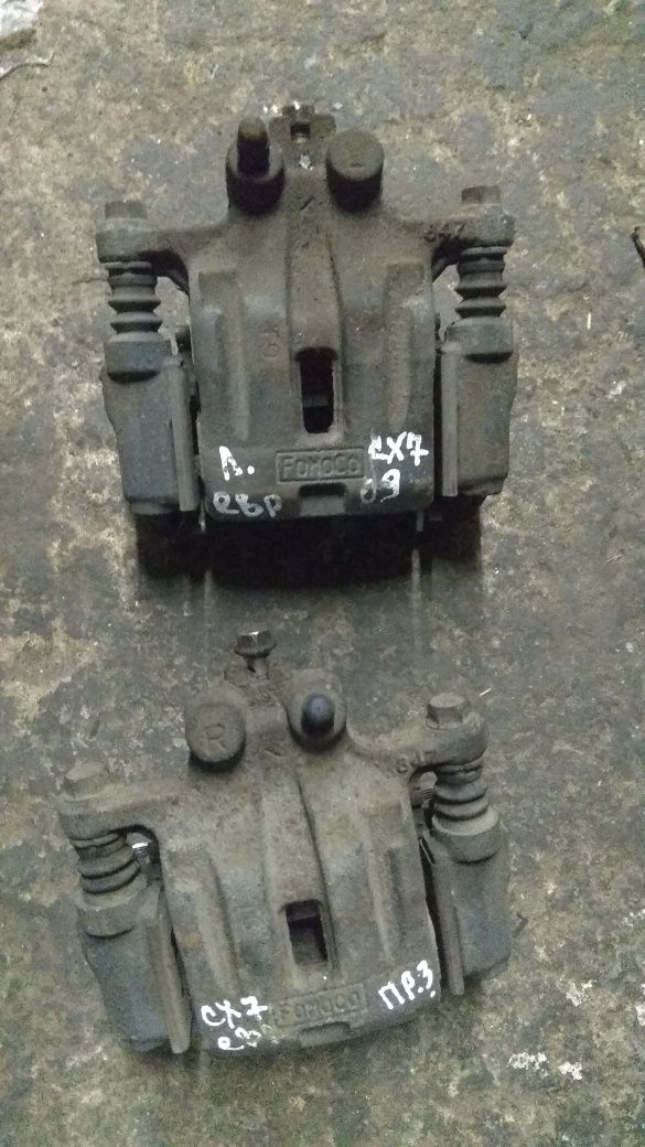 Суппорт Мазда СХ7 передний задний L/R L2Z6-26-98ZA / L2Z6-33-99ZA