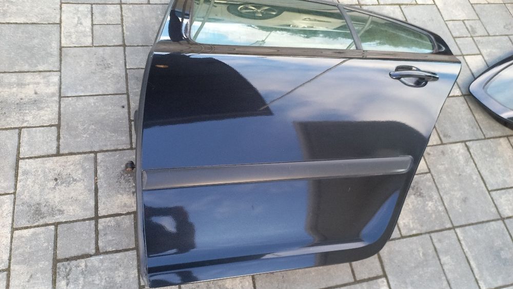 Skoda Octavia 2 04-08 drzwi tylne lewe lewy tyl liftbeck czarne 9910