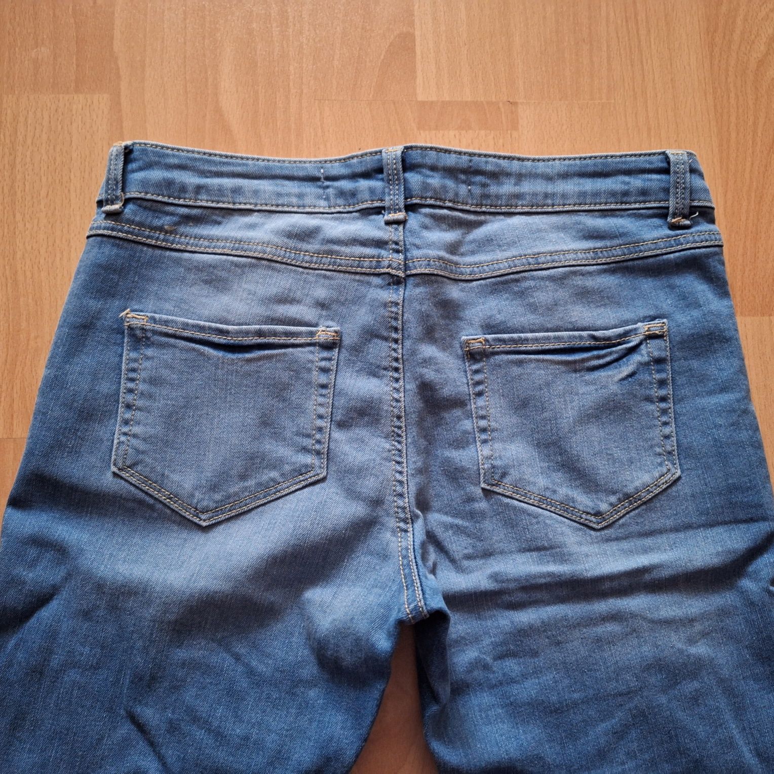 Spodnie damskie jeansy z dziurami 36 S