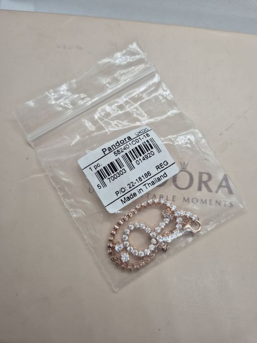 Bransoletka tenisowa złota Pandora.