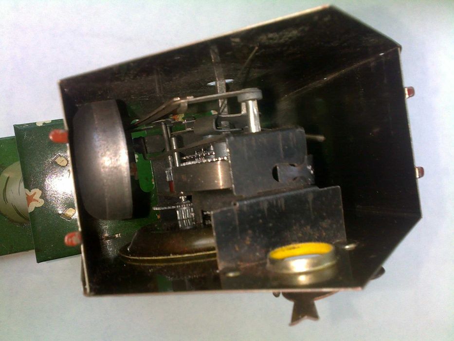 Детская жестяная заводная игрушка с ключиком ссср часы часики птичка