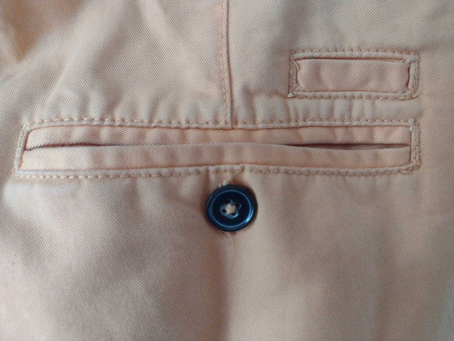 jasno pomarańczowe spodnie Cubus typu chinos - rozmiar W34 L32