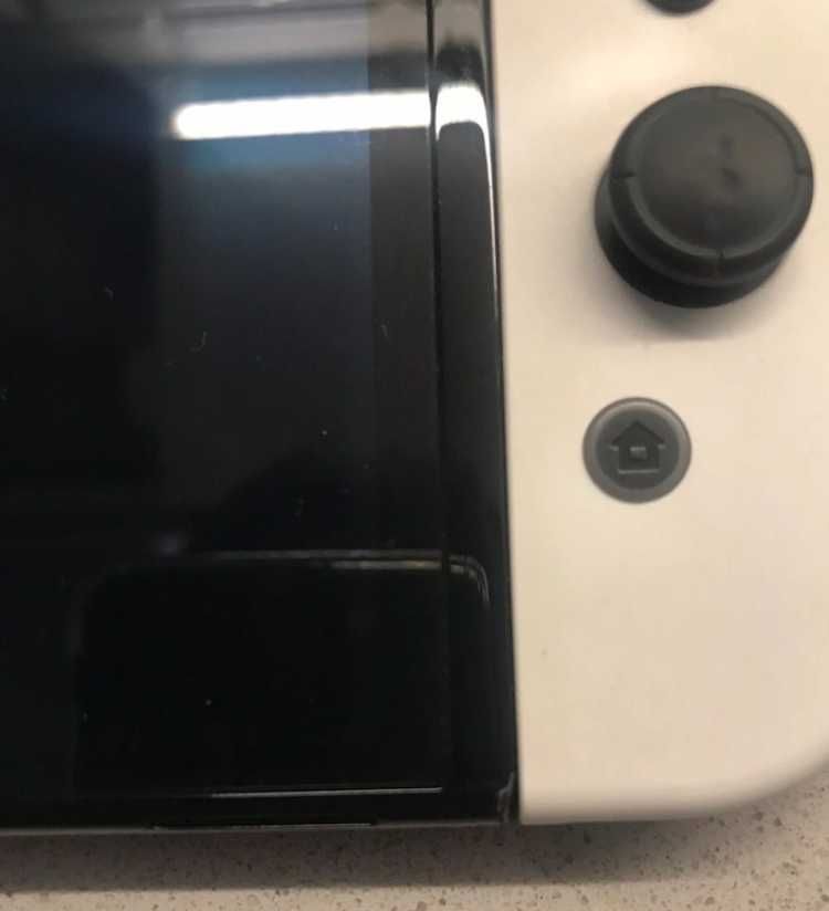 Nintendo switch Oled blanco + joycon extra + estuche protector