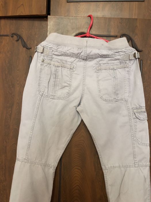 Стильные брюбрюкидля девочки серого цвета на 10-11 лет.