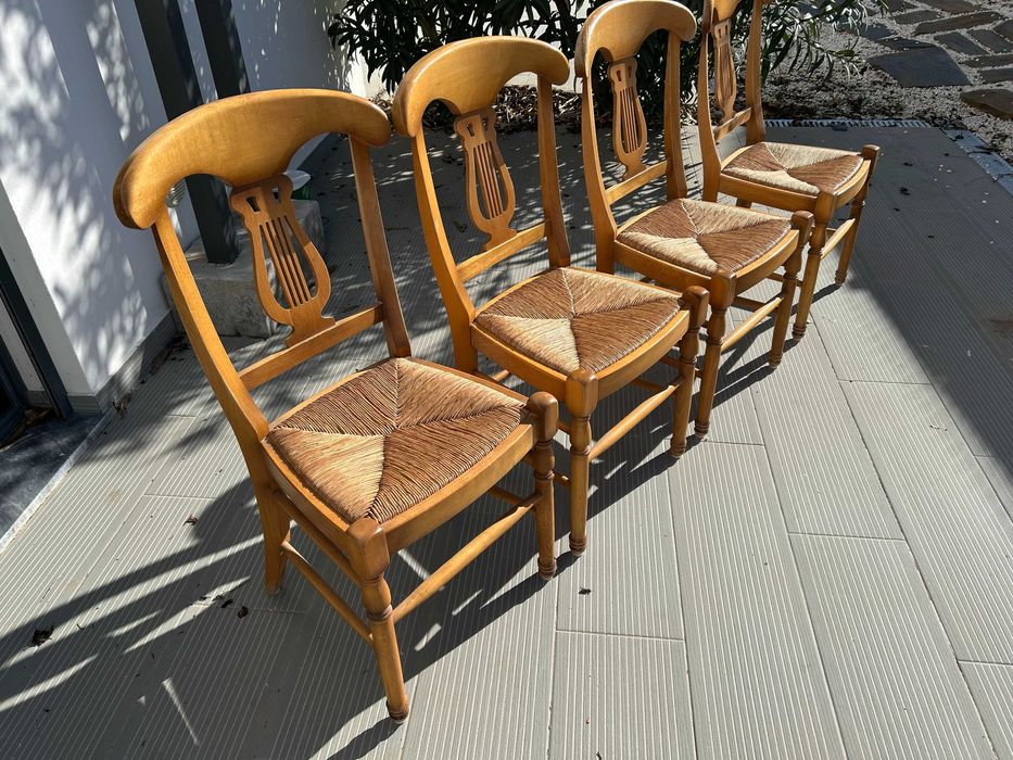 Four vintage dining room table chairs.