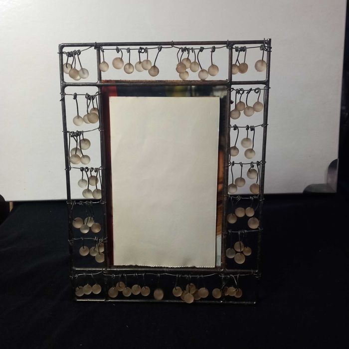 Invulgar moldura anos 30