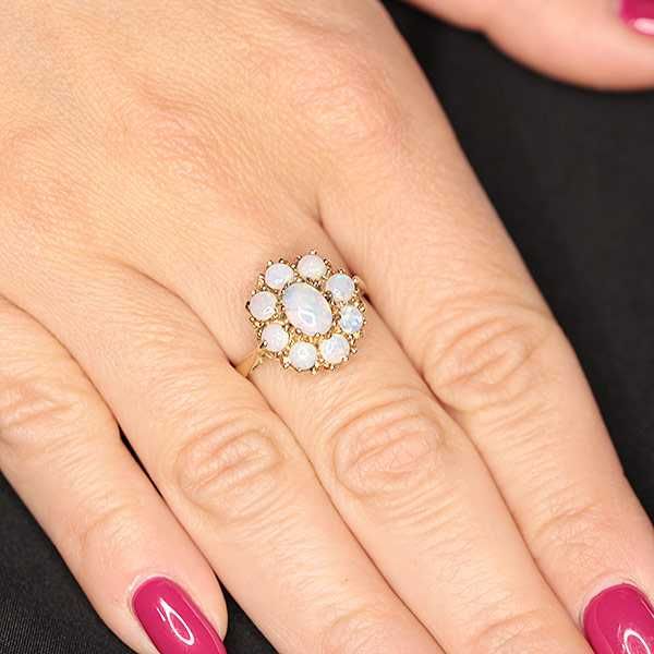 Złoty pierścionek z opalami kwiatek 9K