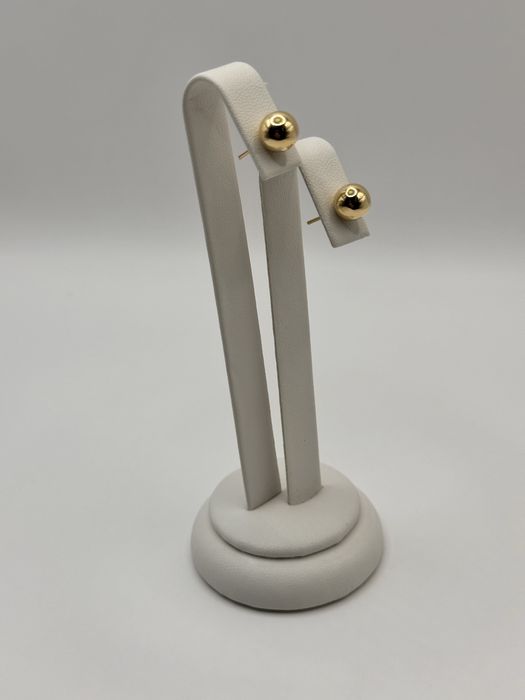 Złote kolczyki kulki