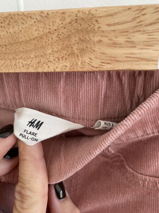 Spodnie h&m 110 pudrowy róż rozszerzana nogawka