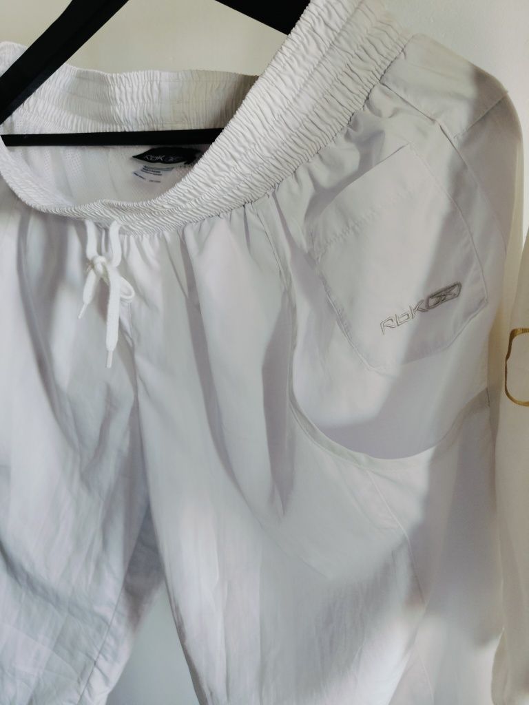 Białe jak nowe Markowe spodnie Reebok spodenki białe letnie 40/L Capri