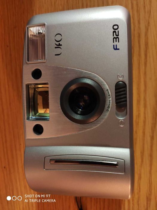 Фотоапарат - новий, плівка.