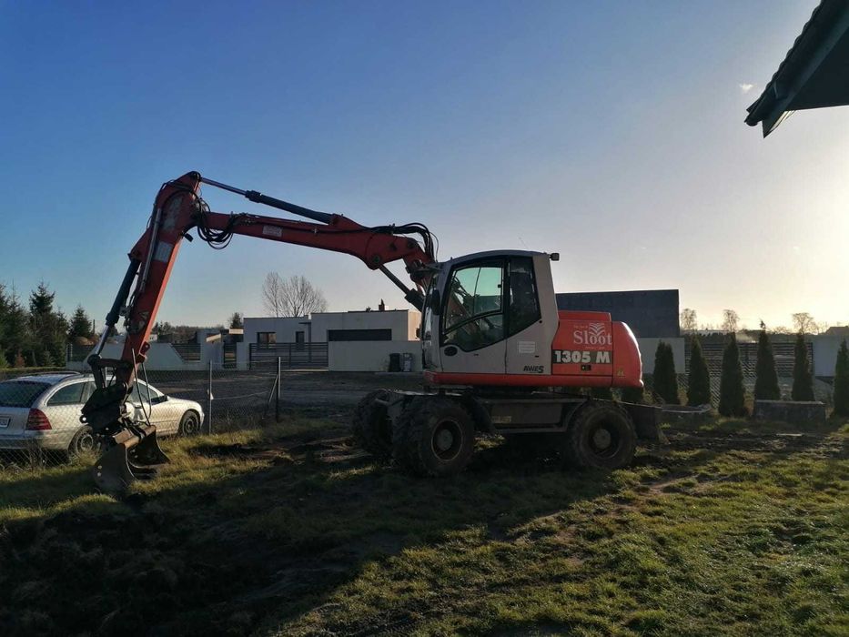 Usługi Koparkoładowarka koparka kopanie prace ziemne transport laweta