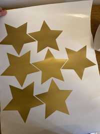 Złote gwiazdki do dekoracji na ścianę