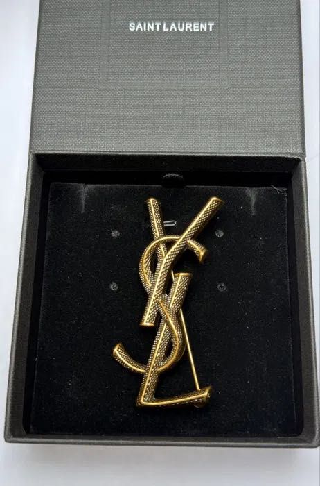 Broszka stare złoto Logo