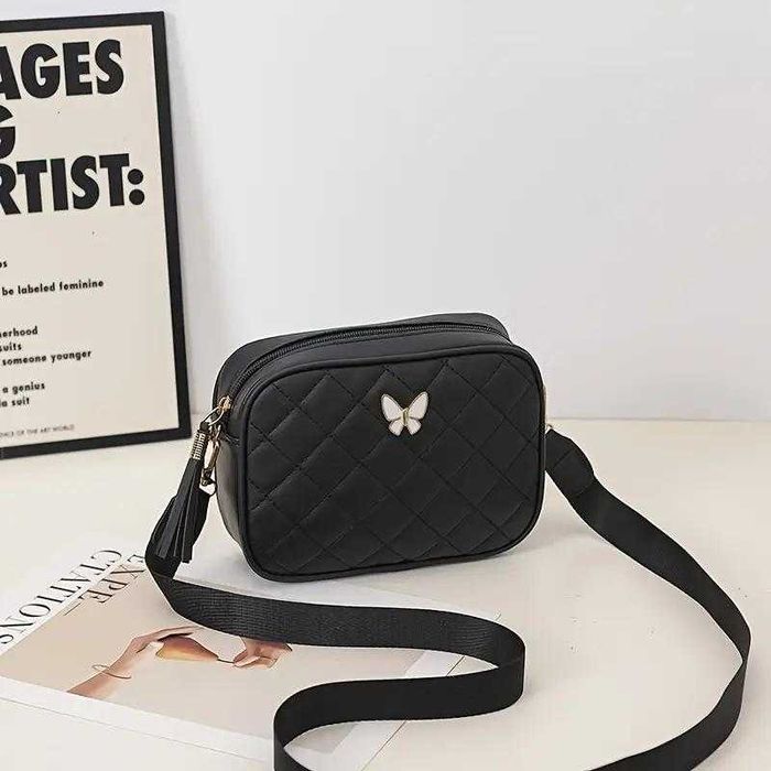 Сумка через плече, зручна з метеликом. Ремішок з написами та без