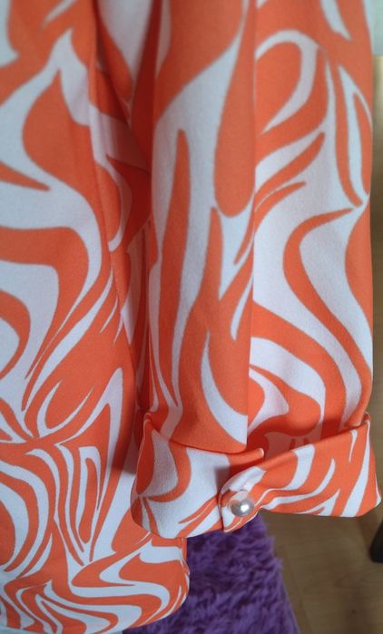 Blazer da pérola com meia manga.