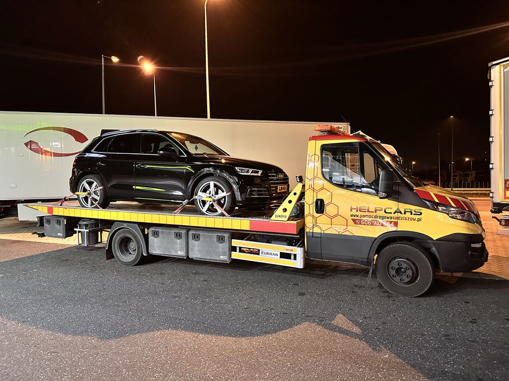 Pomoc drogowa holowanie transport maszyn przyczepa laweta autolaweta