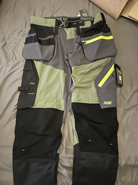 Spodnie Robocze BHP SoftShell Stretch kieszenie Snickers 6940 Oliwkowe