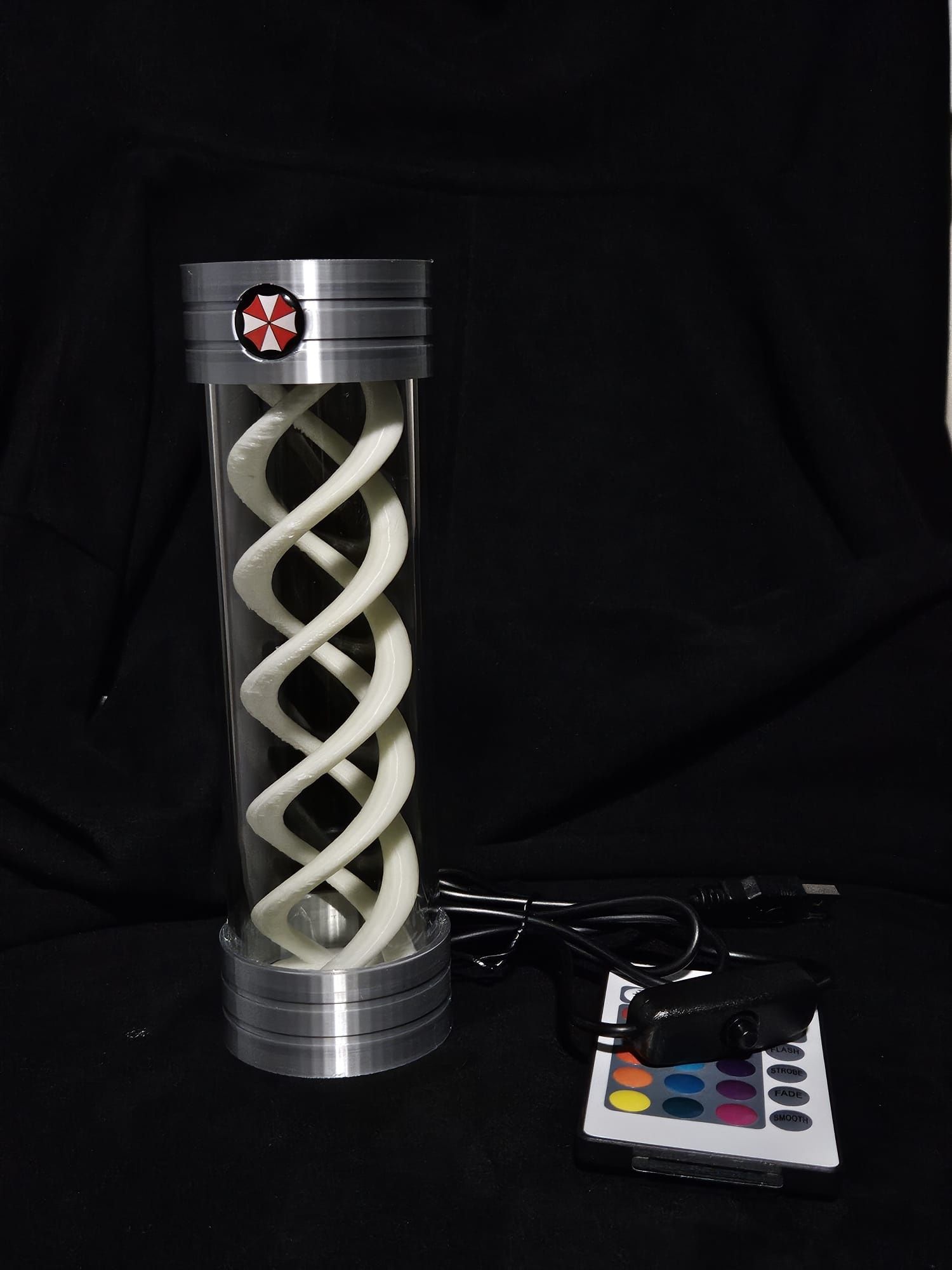 Lampada T-Virus muda de cor e filamento que brilha no escuro.