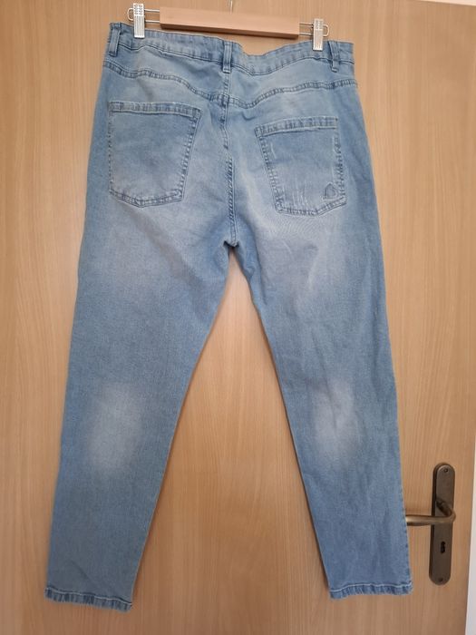 Spodnie jeansowe rozm. 44 z dziurami