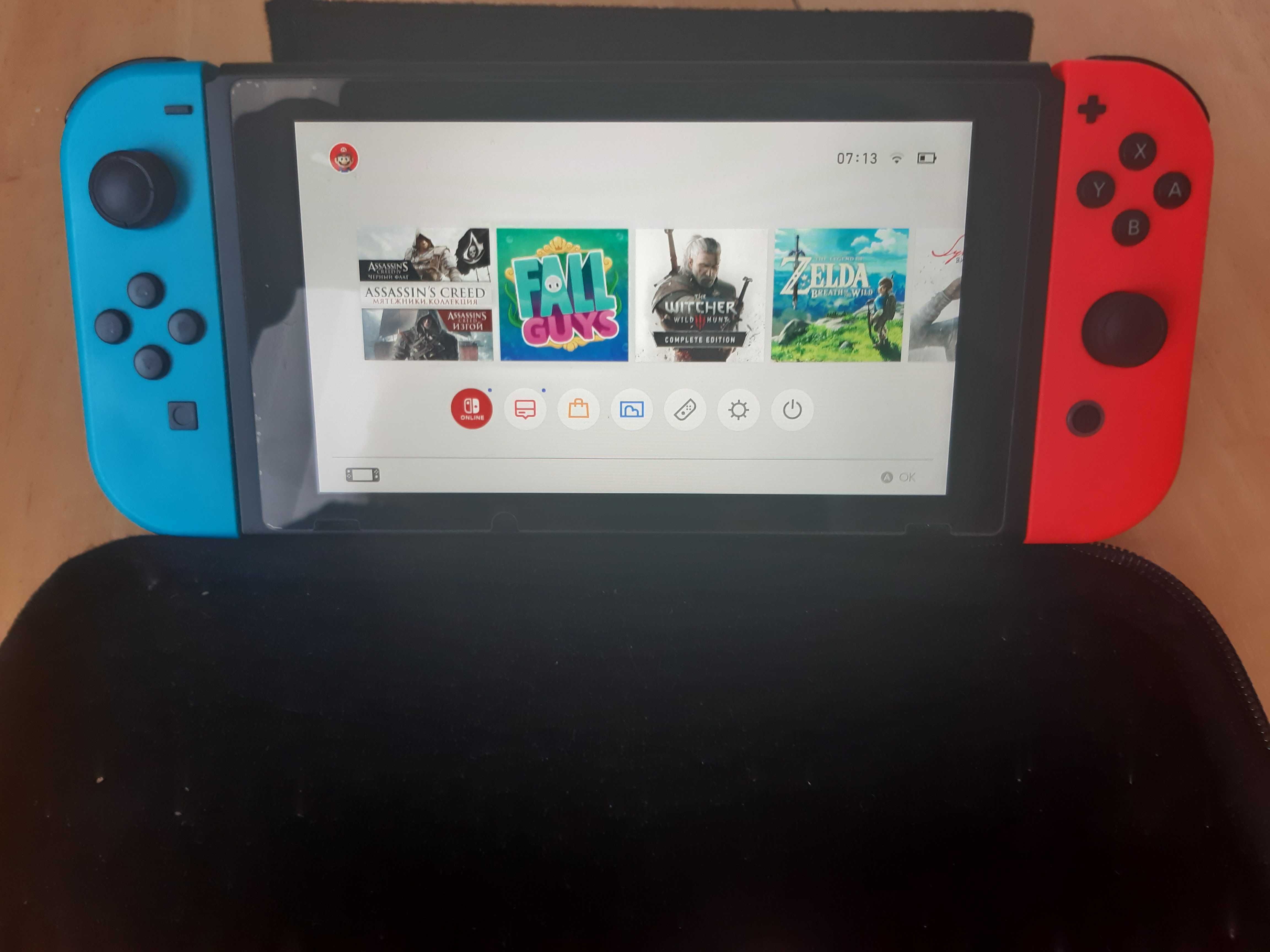 Nintendo Switch в ідеальному стані + 4 гри