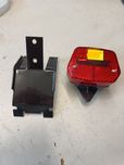 Lampa + uchwyt mocowanie lampy tył czarny Romet pony 301 motorynka