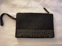 Clutch preta muito versatil