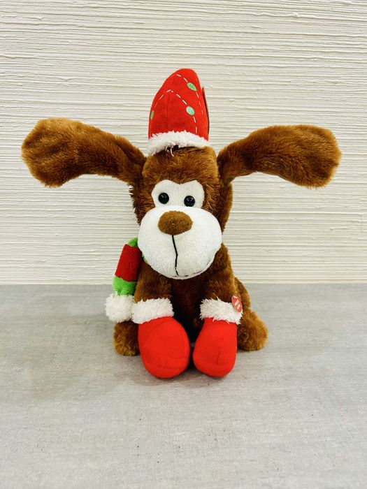 Інтерактивна різдвяна собачка. Співає пісні та шевелить вухами.